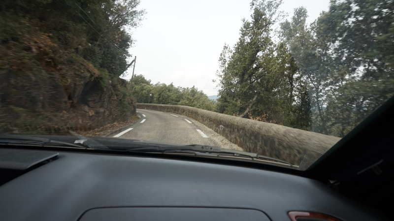Typical part of the road. Mountain on one side, little stone wall with a marvelous view blocked by trees on the other side.